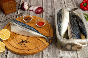  Carcass of hake silvery on a table near a knife