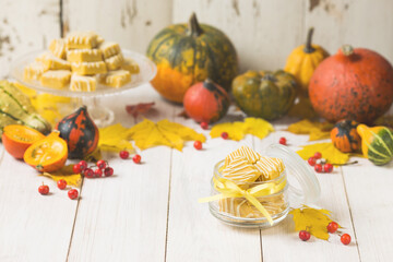 Bright autumn caramel candy and pumpkins