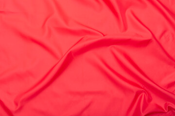 Obraz premium Natural red fabric, texture of red wavy cloth, top view