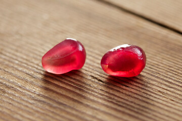 pomegranate red autumn fruit on wood background 
