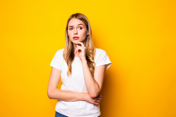 Portrait of young woman think thoughts touch chin hands isolated over bright color background