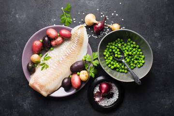 Cod white fish potatoes dish ingredients for healthy comfortable home food. Raw white fish fillet...