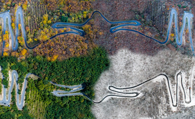 Seasons Concept summer winter fall spring Aerial view Winding road serpentine mountain pass village Brodenbach Germany