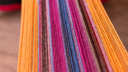Close up of Peruvian alpaca thread in a loom
