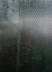 Perforated metallic grid, industrial background. Steel plate with holes