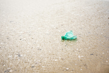 Fototapeta na wymiar Plastic and microplastic in the sand beach