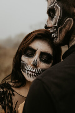 Couple with dark skull makeup. Halloween face art. Adult. Couple in love. Passionate concept. Halloween concept. Fashion photo. Just one kiss. Kissing man and woman. female.