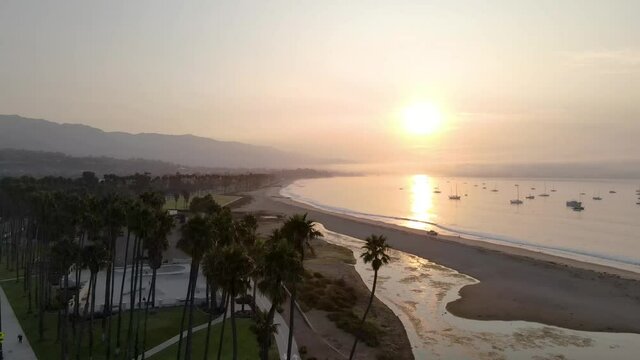 Sunrise in Santa Barbara, CA with palm trees and the beach