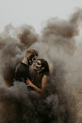 Lovely couple in black smoke halloween. Authentic love and natural light.