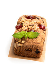 Mixed fruit loaf cake with almond flakes isolated on white