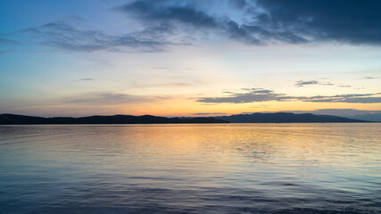 Beautiful dramatic sunset over the sea. Evening on the ocean. Freedom, peace and meditation concept. Soft focus