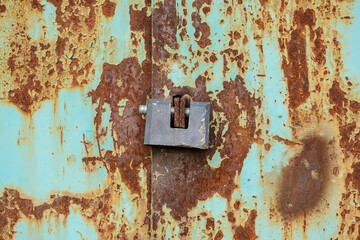 old rusty gates with padlocks