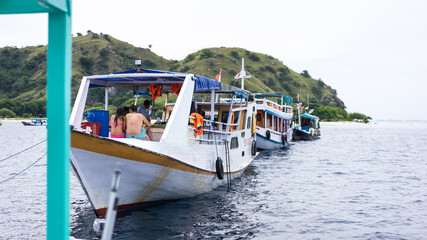 Naklejka premium Labuan Bajo, Indonesia - August 7, 2016: Tourist slow boat in Indonesia. Snorkeling and diving tours under water in Bali, Lombok and Flores. Adventure travel concept. Soft focus