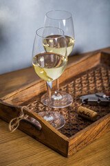 Glass of white wine on vintage wooden table