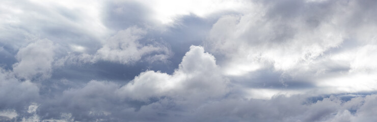 Obraz premium Panorama of rainy sky with voluminous gray clouds