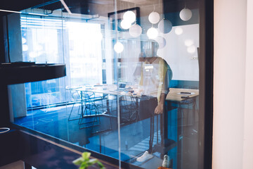 Caucasian male entrepreneur discussing business during cellphone communication with partner, successful smart casual man using smartphone 4g internet for online phoning and talking with operator