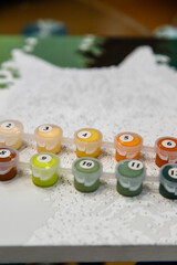 Picture by numbers. Drawing on canvas. Selective focus. Close up.