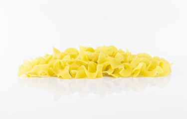 Uncooked Italian pasta on white background