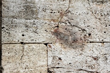 Ancient stone tiles wall vintage background.