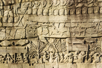 Fototapeta na wymiar Bas reliefs depicting the naval battle between Khmer and the Chams at Bayon temple, Angkor, Siem reap, Cambodia
