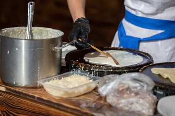 Pour batter for pancakes into a frying pan