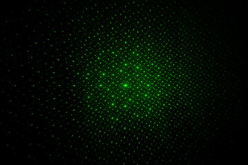 Abstract lines of green laser light on black background