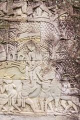 Fototapeta na wymiar Bas-relief depicting the battle between Khmer and the Chams at Bayon temple, Angkor, Siem reap, Cambodia