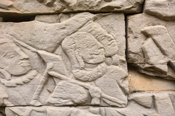 Detail of bas relief of khmer warrior on the Bayon, Angkor Thom, Siem Reap