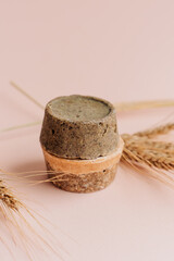 hand-made solid dry shampoos of a round shape on a plain beige background. natural hair cosmetics. soap for handicraft from chamomile and eucalyptus. environmentally friendly products, no waste
