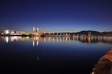 Night view of the port in Rijeka city, Croatia. Rijeka city of culture 2020 night lights of the harbour, wiev from the sea. Night scene in the city of Rijeka, harbour in Croatia