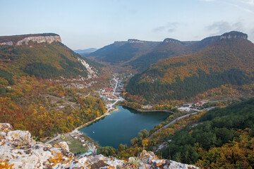 Fototapeta na wymiar Beautiful autumn landscape with mountains and mountain lake. The colors of autumn.