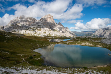 Fototapeta na wymiar an alpine lake with the reflection of the mountains in the Dolomites in South Tyrol, Italy