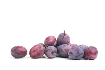 Blue plum fruits on a white isolated background. Fresh, juicy fruits. Agricultural products.