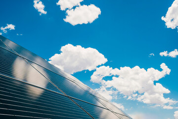 Solar panels in the desert with blue skies and puffy white clouds