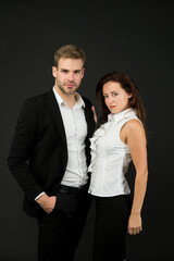 Business partners of handsome man and sensual woman wear formal fashion style dark background, couple