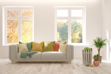 Stylish room in white color with sofa and autumn landscape in window. Scandinavian interior design. 3D illustration