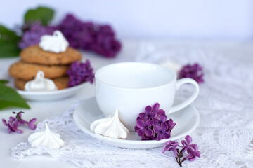 white cup and flowers