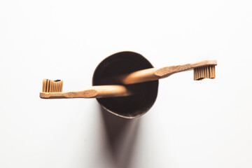 Wooden bamboo toothbrushes on white background isolated. The concept of zero waste, recycling