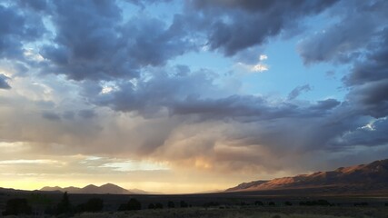Fototapeta na wymiar Cloudy Sunset over Rural Nevada Horizon