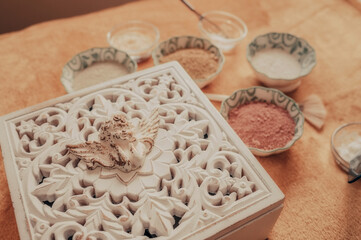 massage aroma therapy salon with essential oils and vintage decorations in natural light and warm tones