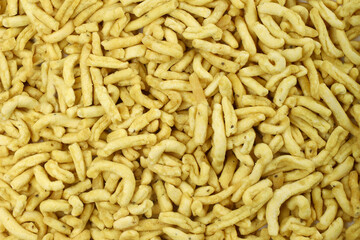Indian snacks food gathiya sev as background texture.