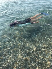 person snorkeling in the sea