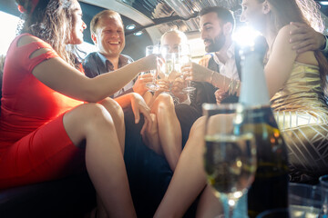 Crowd of party people in a limo with drinks