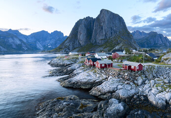 Famous tourist attraction Hamnoy fishing village on Lofoten Islands, Norway with red rorbu houses, in summer.