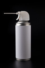Can with compressed air spray on a dark background