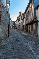 Obraz na płótnie Canvas Alley with half timbeed medieval houses at the old town of Bernay, Eure, Normandy, France