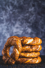 Bagel with sesame on black background	