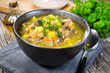 Polish barley soup with vegetables and chicken heart.