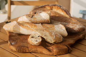 serving bread for Breakfast, sliced baguette with olives