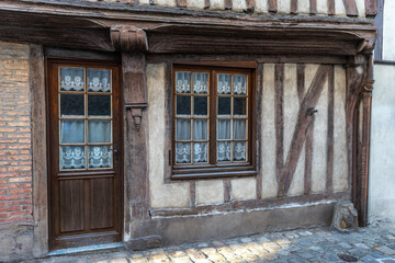 Fototapeta na wymiar Traditional half-timbering house in historical part in France, Normandy Bernay